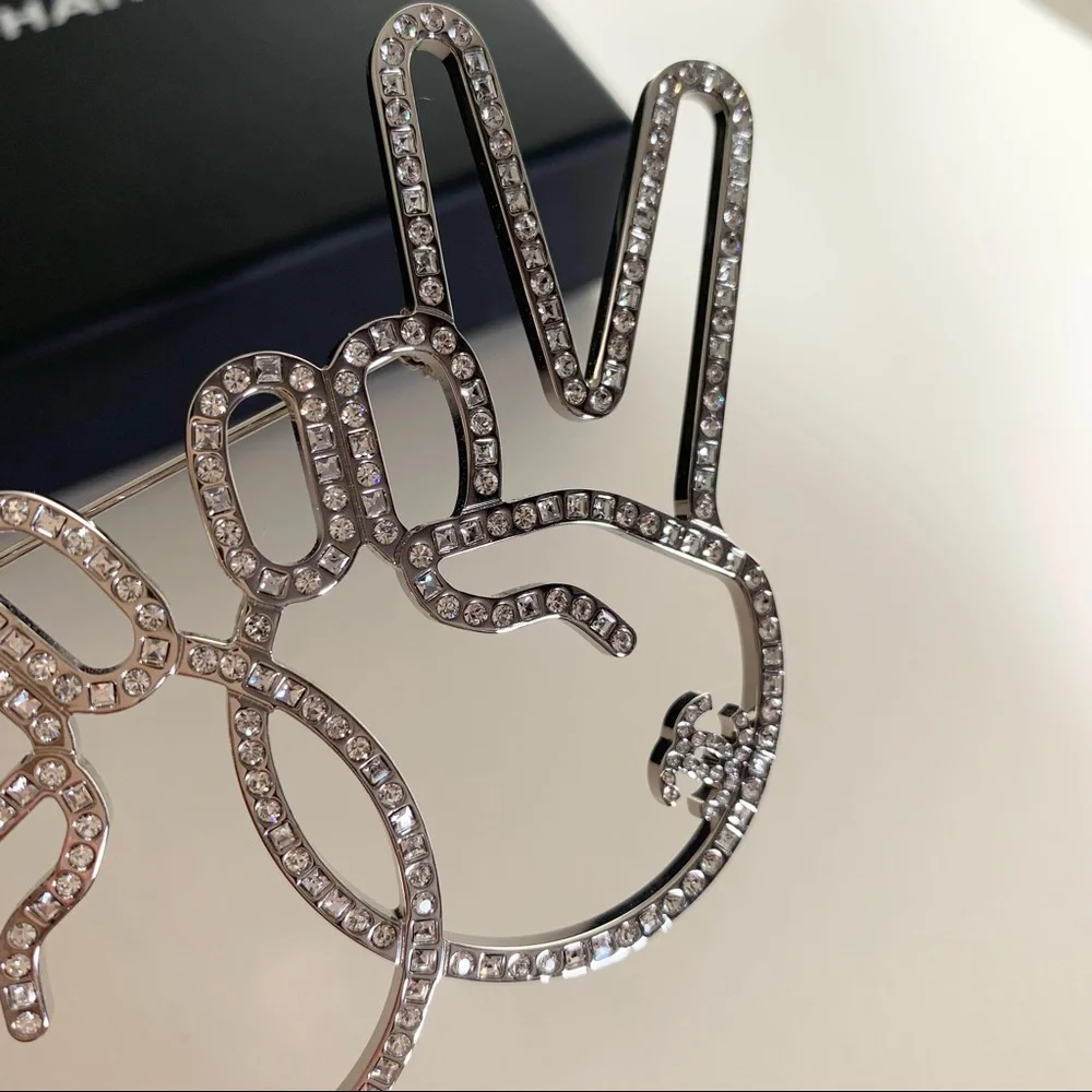 Chanel large peace hands pin